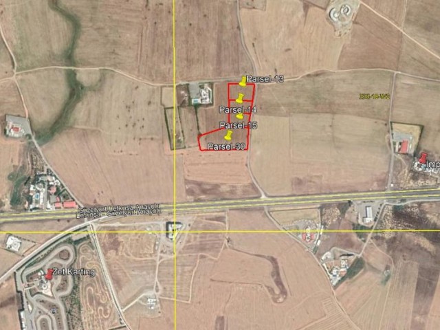 A 14-DECARE PLOT WITH A COMMERCIAL PERMIT IS FOR SALE IN ALAYKOY, NICOSIA, 150 METERS FROM THE NICOSIA-GUZELYURT HIGHWAY. ** 
