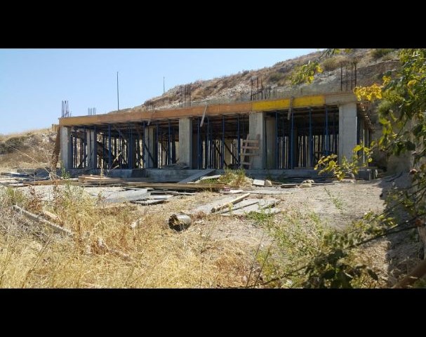 Bayrakla in Lefke, 1 donum of unfinished construction land for sale on the mountain side. There is water and electricity. With a sea view. stunned