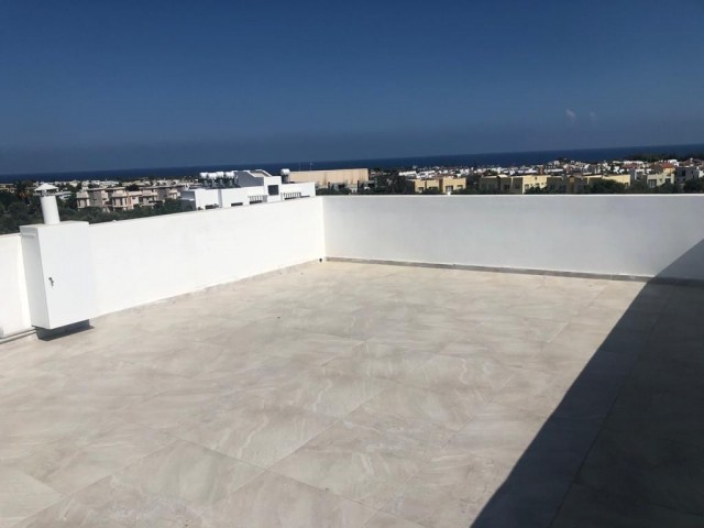 1 + 1 Apartment for Sale in Kyrenia Olive Grove with a Terrace Overlooking the Sea with a Turkish Co