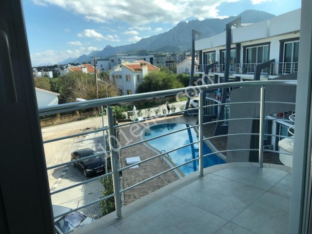 Studio apartment for sale in Alsancak within walking distance to the main street with communal pool with sea view roof terrace belonging to the apartment fully furnished all expens
