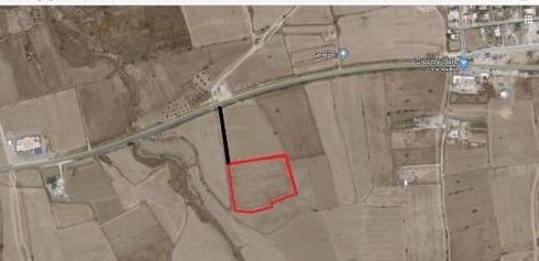 A plot of land with a road behind the main road in Serdarlı. ** 